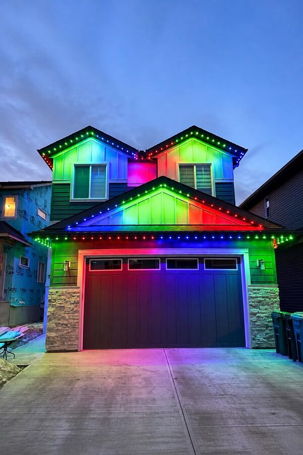 Permanent LED lighting in rainbow color mode on a Calgary home