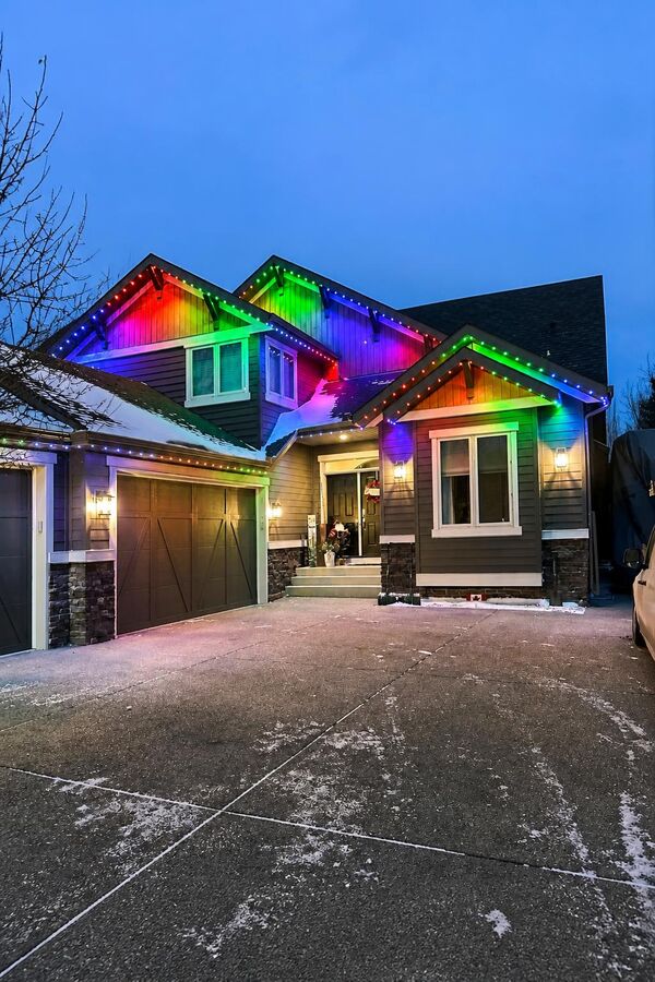 Permanent LED lighting in blue and purple tones on a Calgary home
